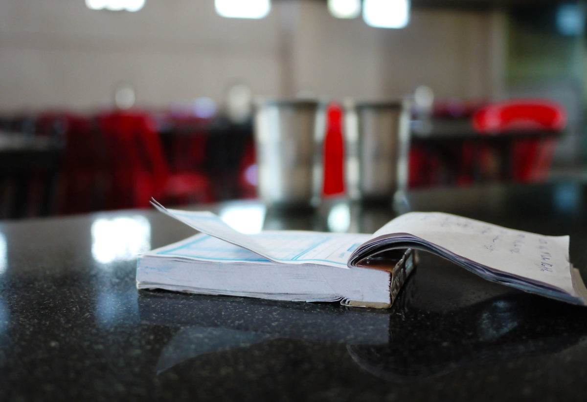 A duplicate receipt book being used at a cafe